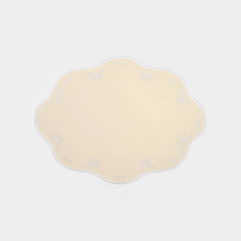 Placemat, 30x40 cm, PVC / polyester, shaped, light yellow, Bows, Rock embroidery